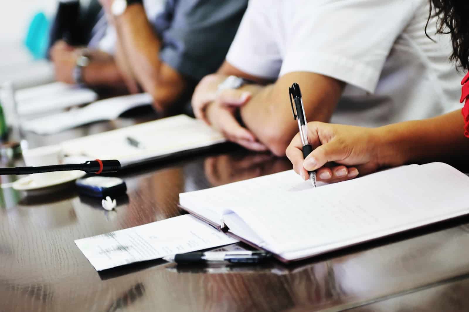 business beople on meeting conference taking notes and make deal